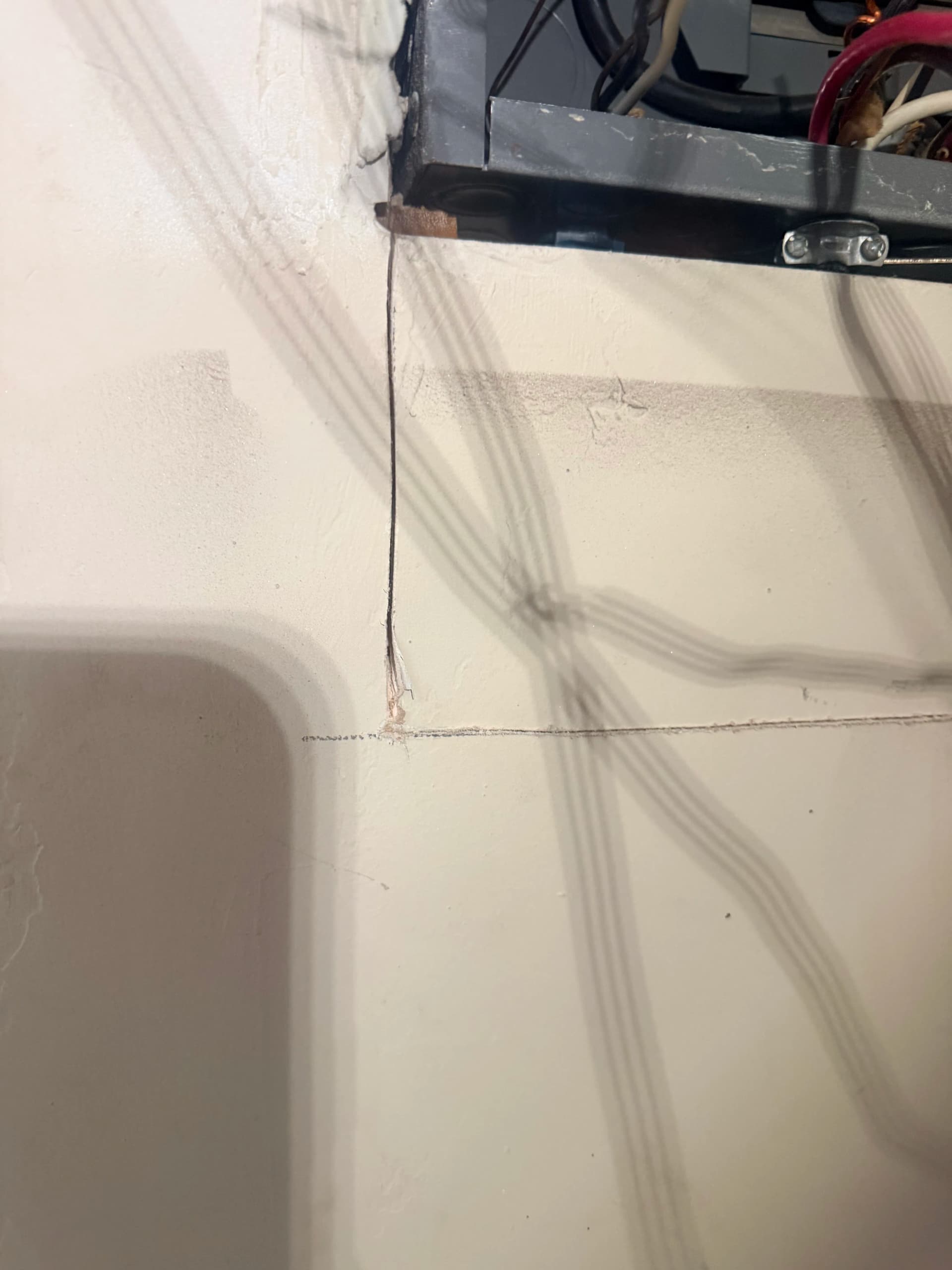 The Hidden Junction Box Behind the Wall Causing a Short image